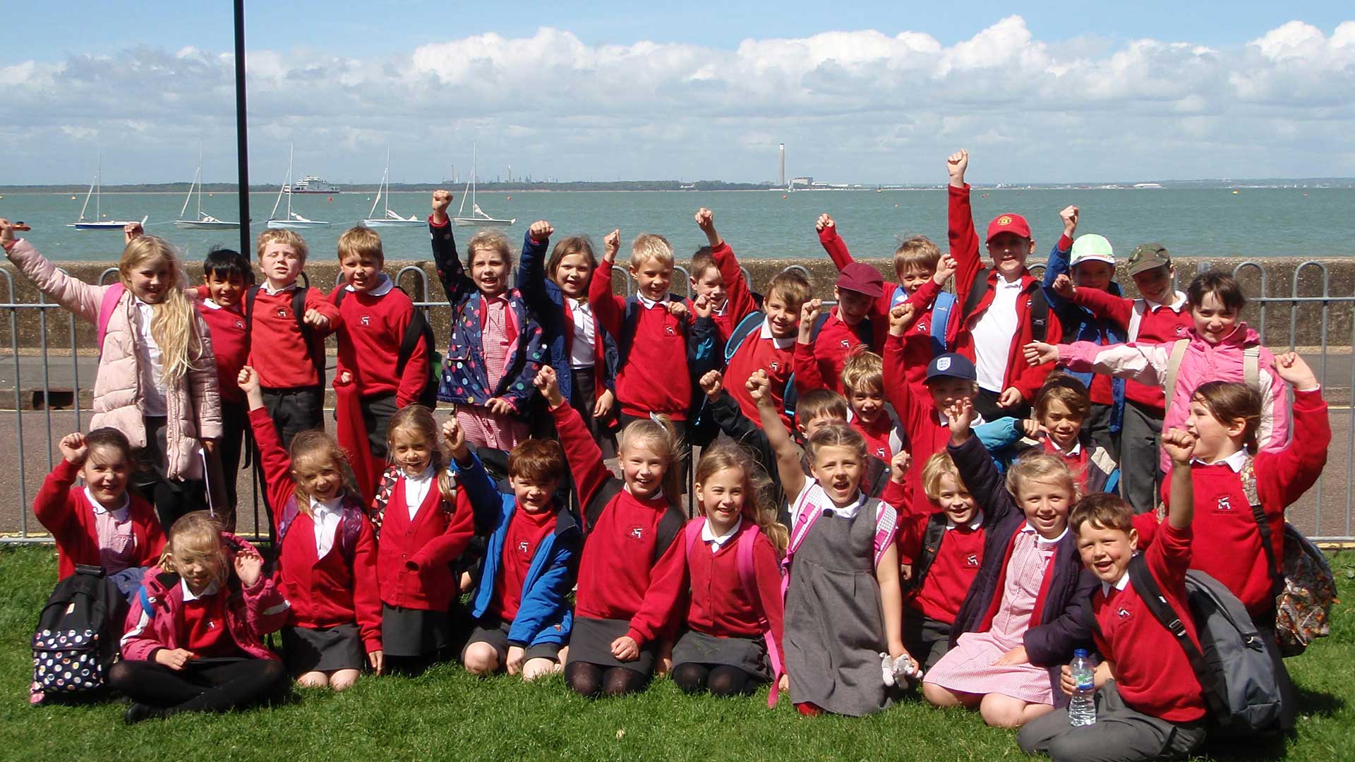 Children cheering on a https://dorsetschooltrips.co.uk/ school trip
